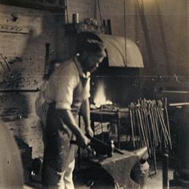 A person working in a blacksmith shop

Description automatically generated